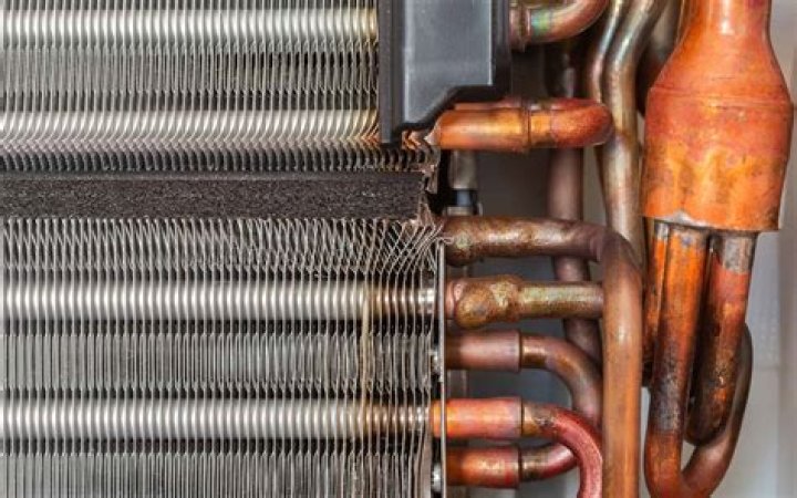 How often should AC evaporator coils be cleaned?