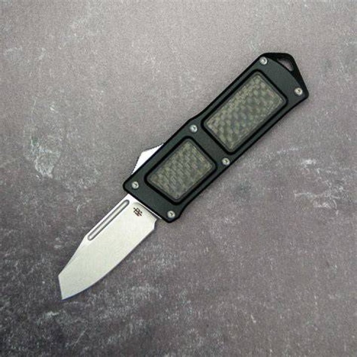 What is a double action OTF knife?
